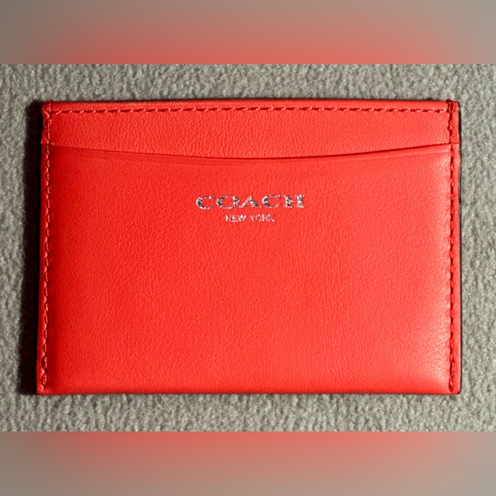 Coach y2k slim card case in dark coral.